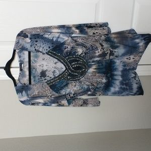 Beautiful 3/4 sleeve stretchy blouse with beaded detail on the front